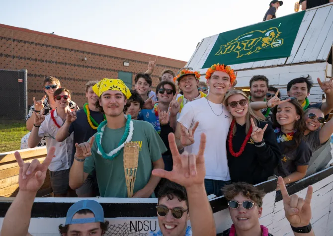 students participating in a Homecoming parade float