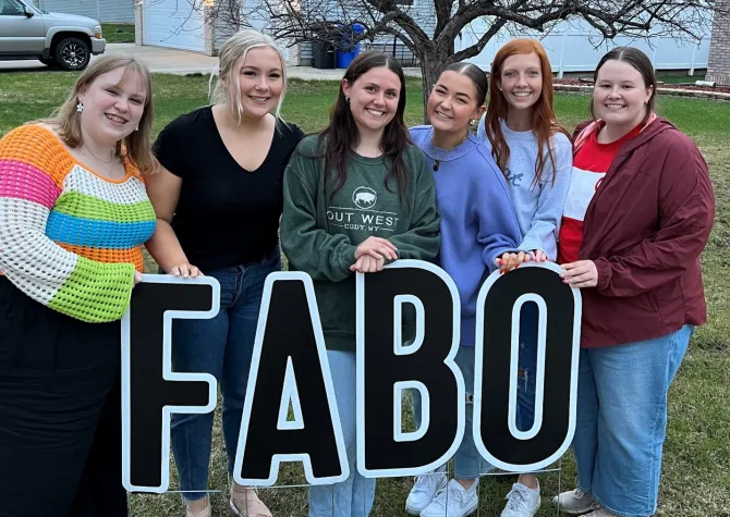 Students posing in front of F-A-B-O letters.