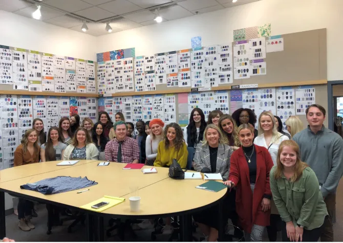 A group of students smiling at camera.