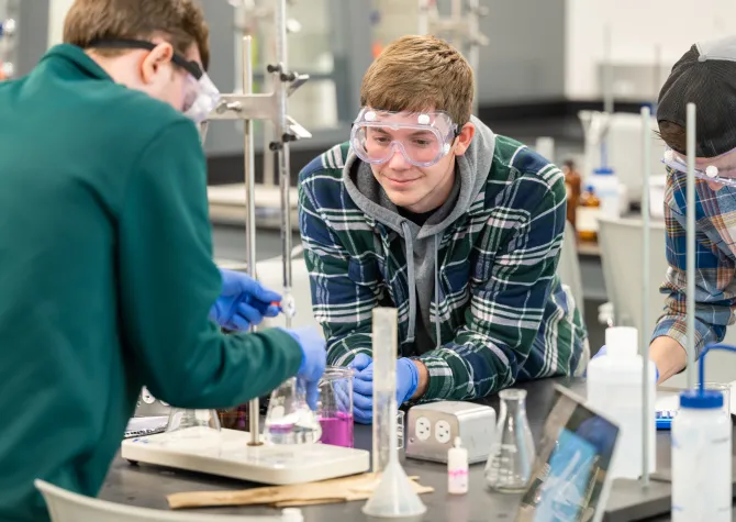 Students performing an experiment in lab