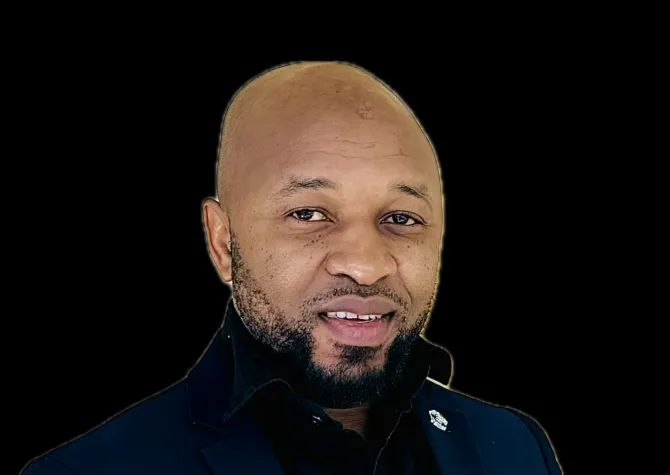 Ogechukwu smiling confidently at camera.