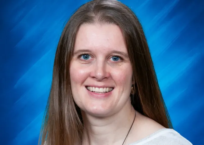 Melissa smilling confidently at camera