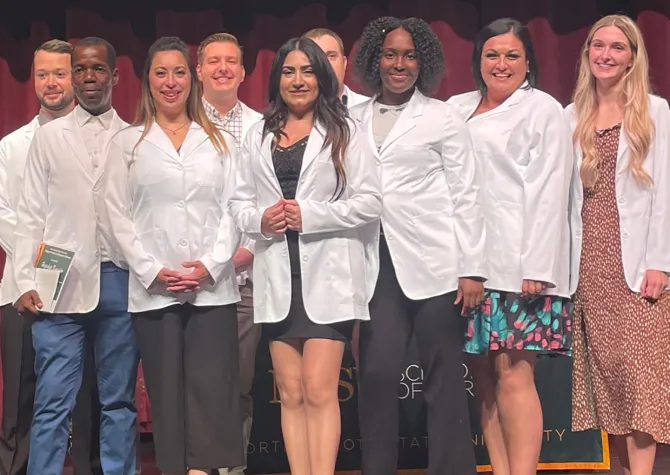 Image of nursing students in white coats