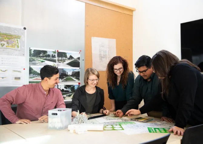 Carlos Montoya working with colleagues.