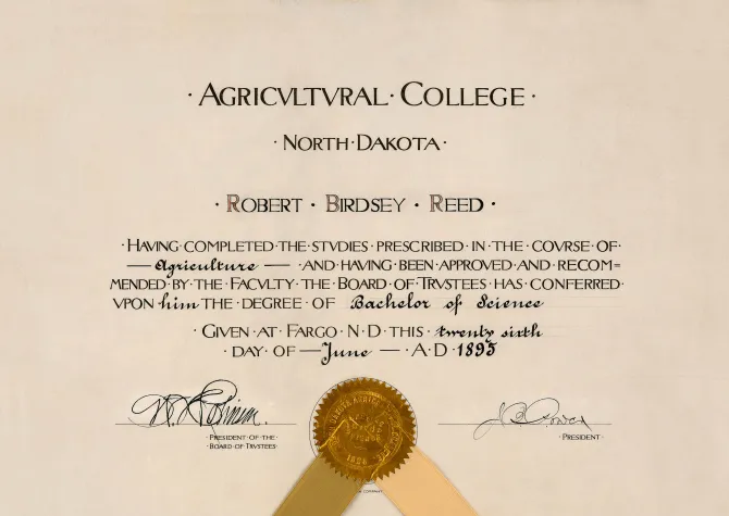 Diploma with writing and gold seal.