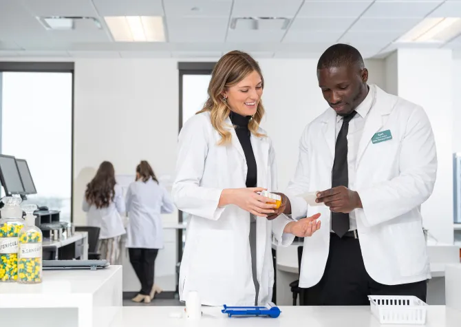 Students in a concept pharmacy lab
