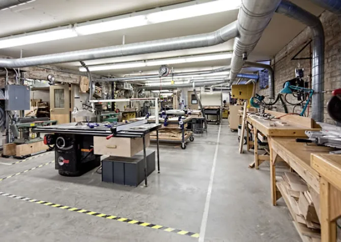 Woodshop with tables and equipment.
