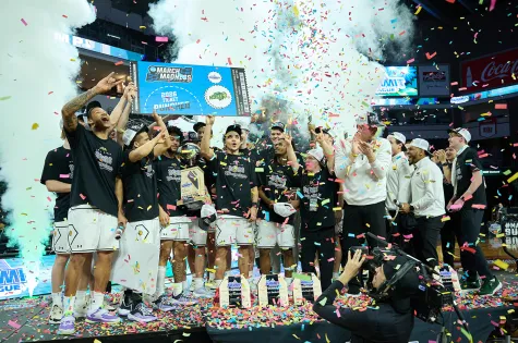 NDSU men's basketball team celebrate after winning the Summit League Tournament title