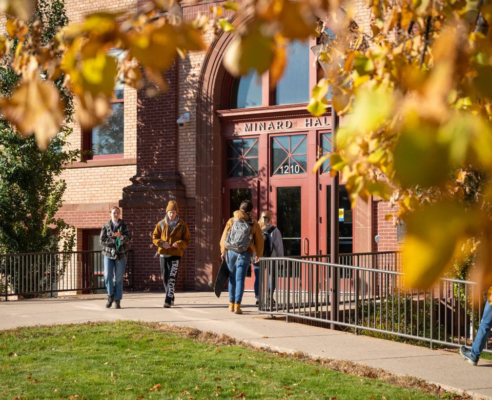Students leaving academic building in fall