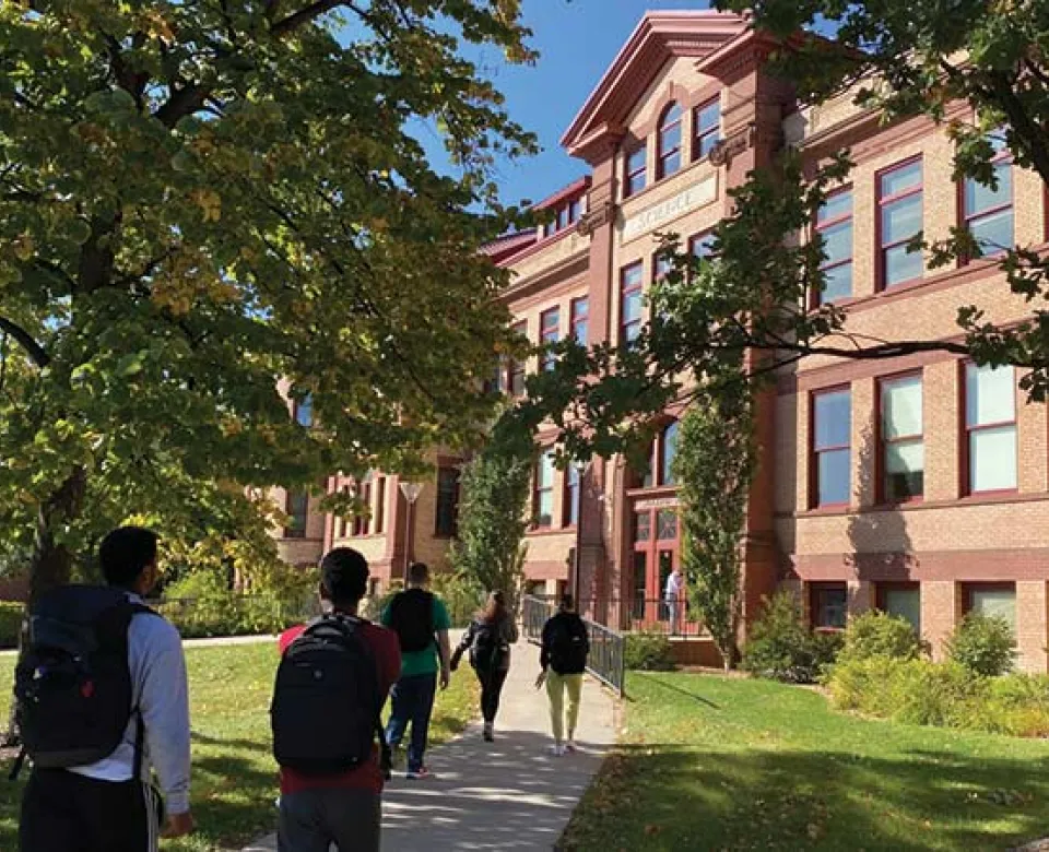 Students walking into Minard Hall.