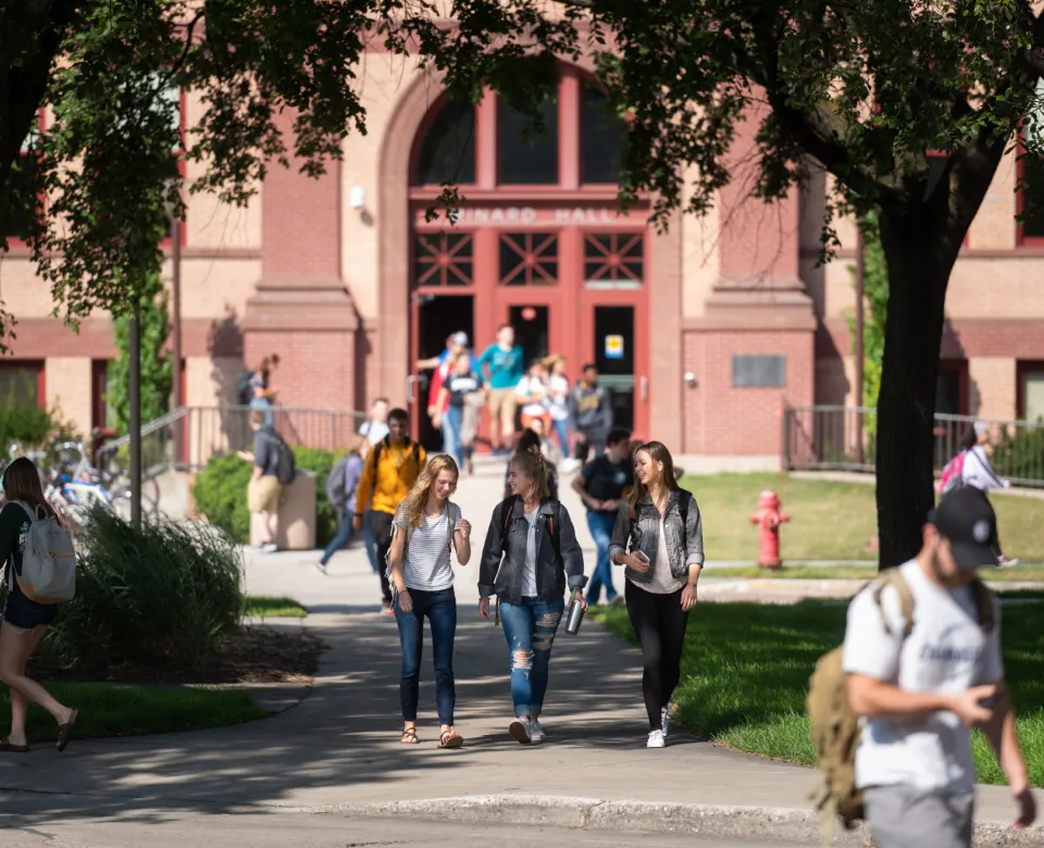 Students walking out of Minard Hall after class.