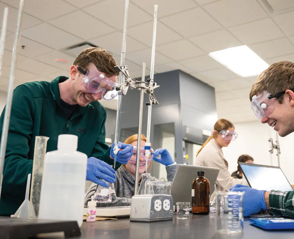 Students performing an experiment in lab
