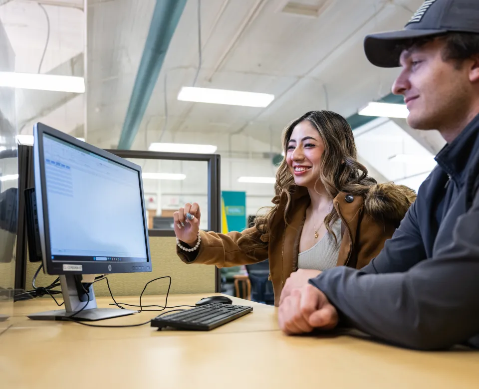 Student being tutored in the TRIO office