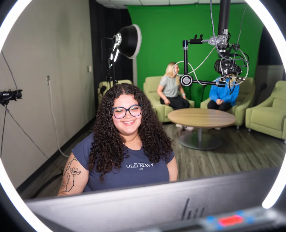 students using the podcast room at the library