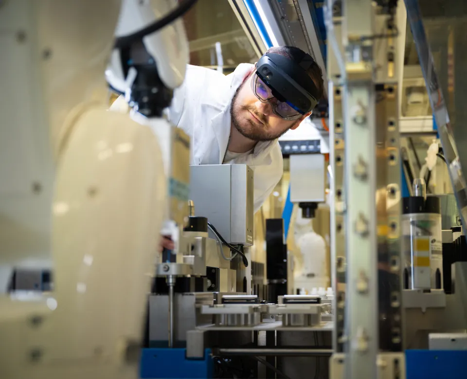 student working with coatings and polymers equipment