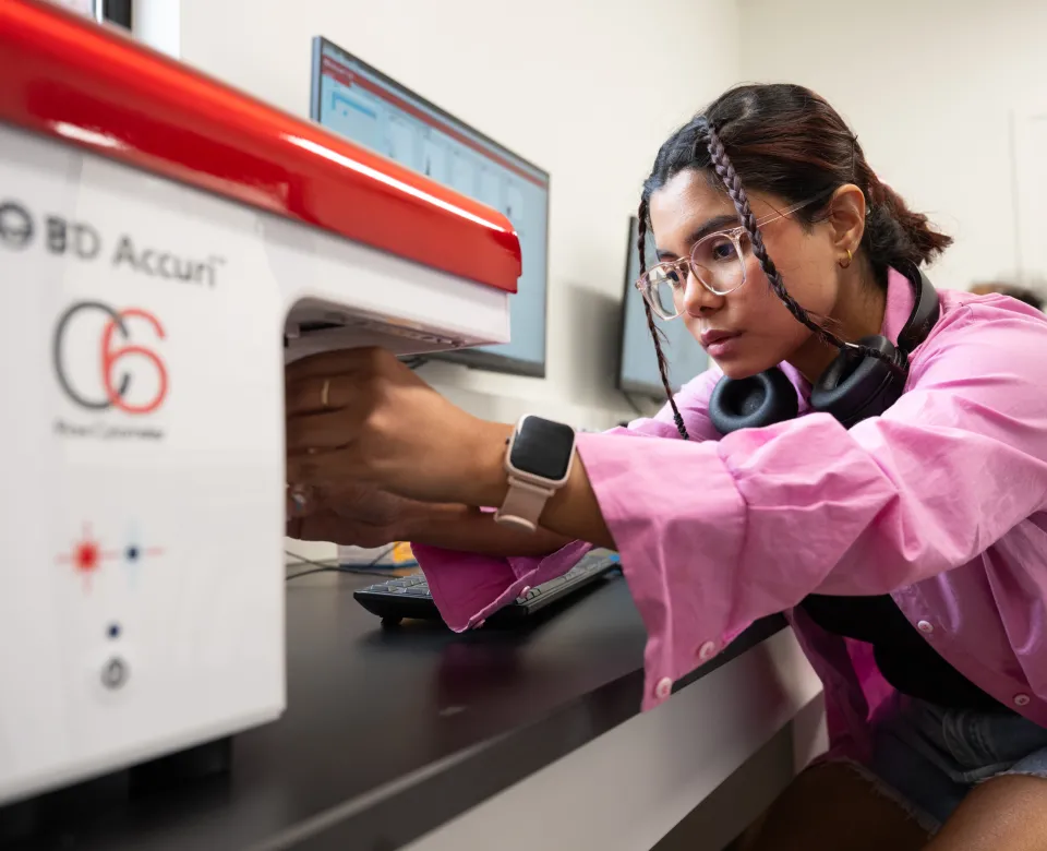 Student using BD Accuri machine in lab