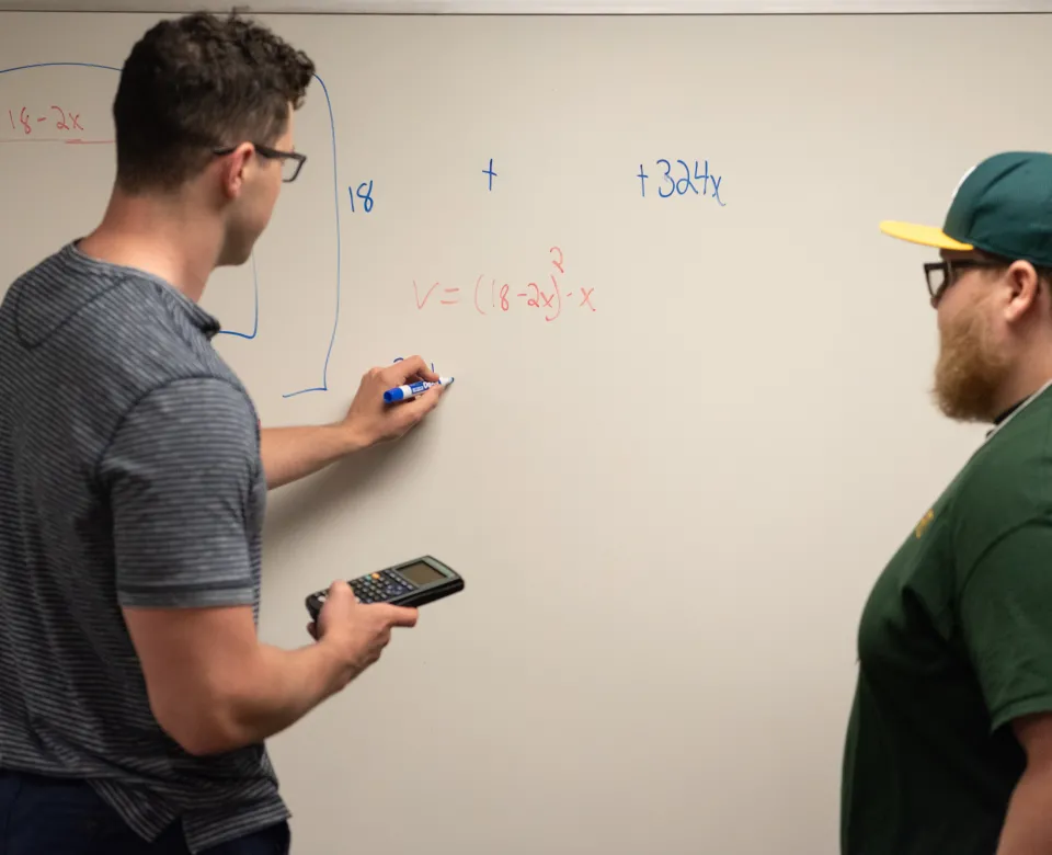 A student tutors another student in math