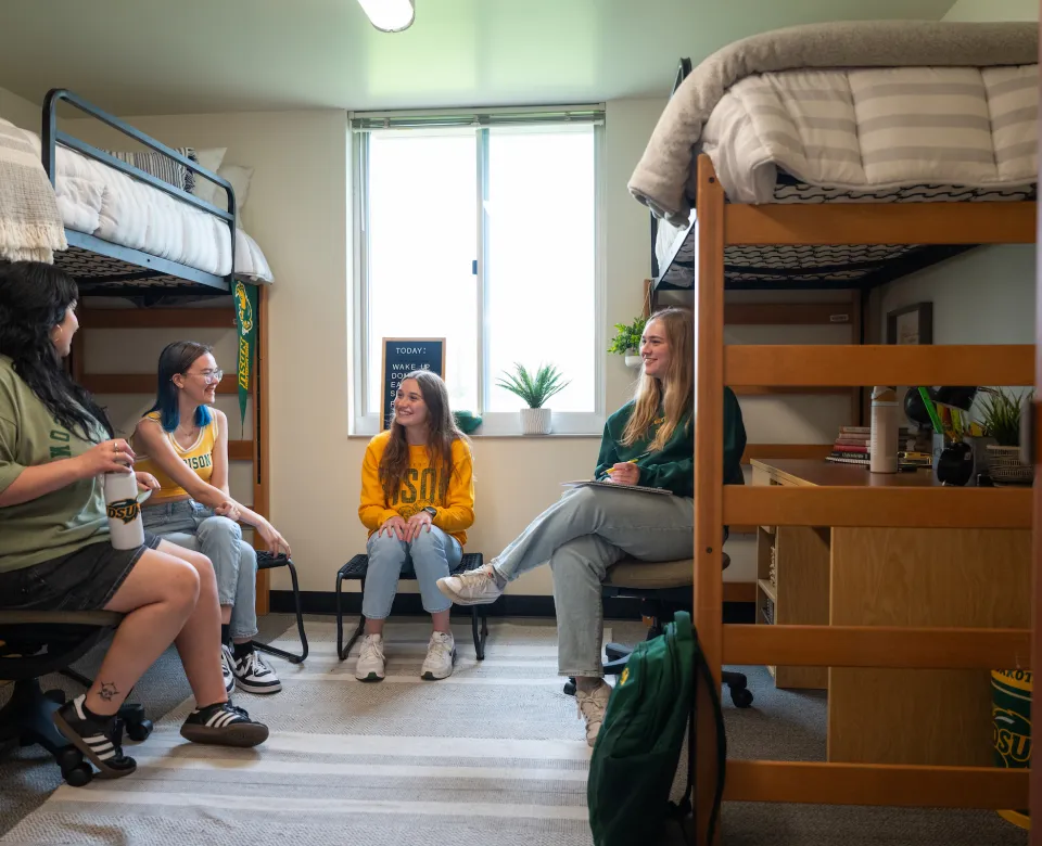 students gathered in a Pavek Hall room