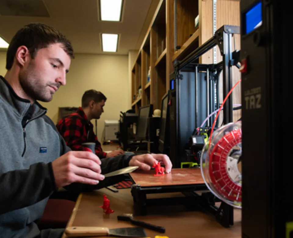 Student working in the Digital Fabrications Lab at NDSU.