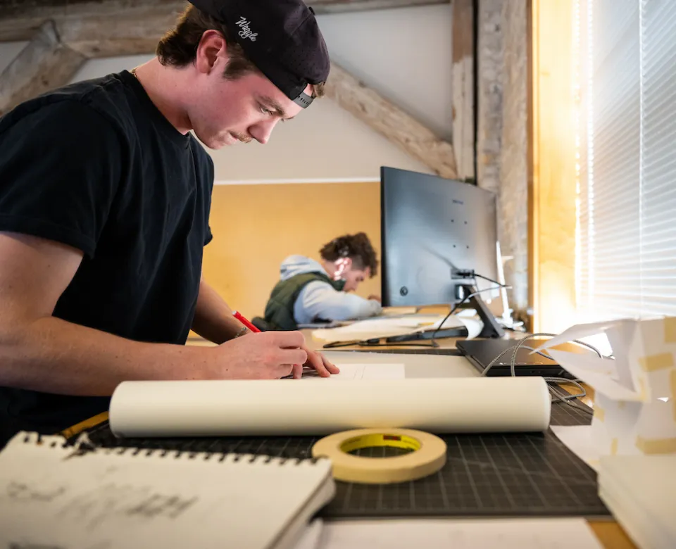 Student working with pencil and paper.