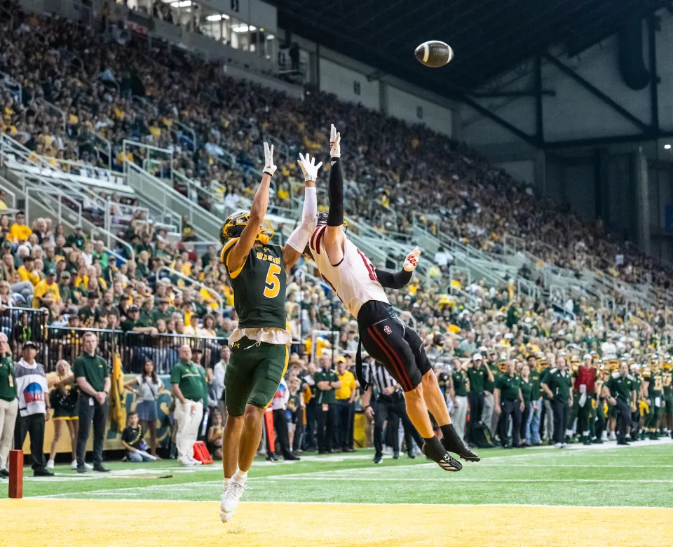 NDSU Bison football player catching the football in the endzone for a touchdown