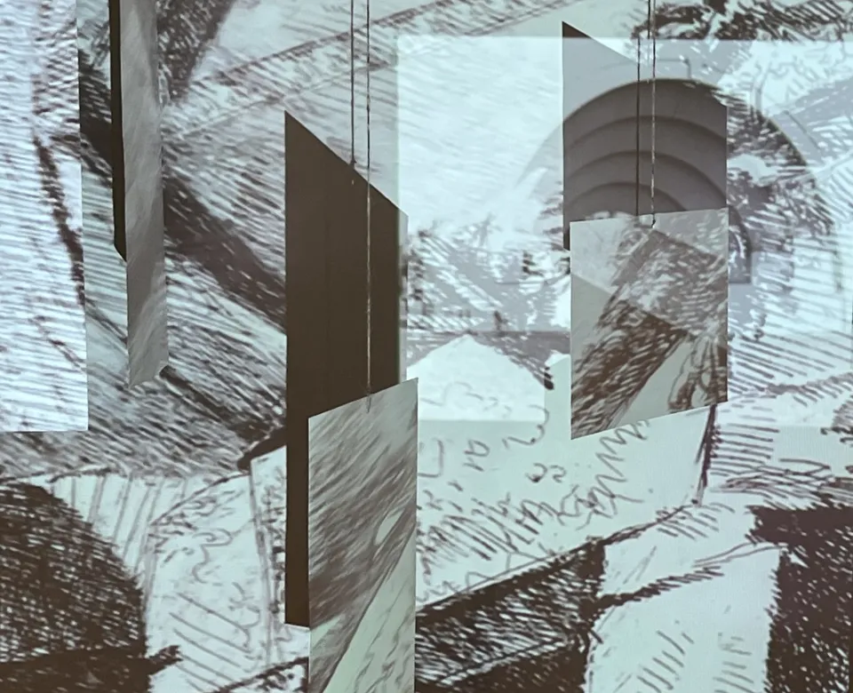 A photo of a bowl with blue water and a drawing of a root that is leading into the bowl.