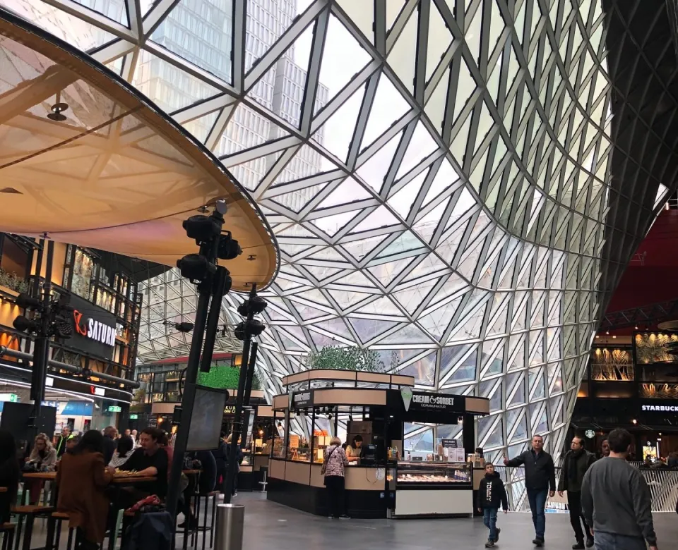 Shot of a mall with unique architecture and various shops and restaraunts