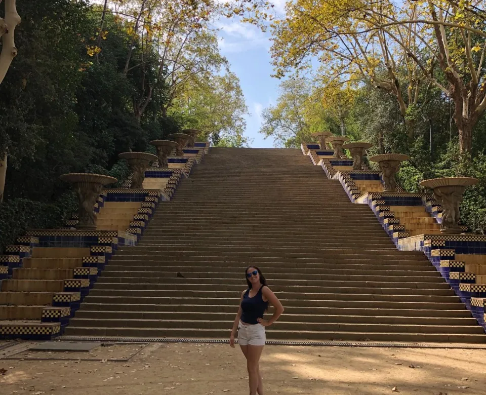 Student in front of large staircase