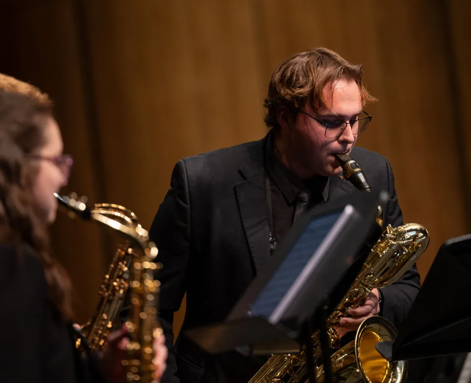 A saxophone student playing in the NDSU Wind Symphony concert.