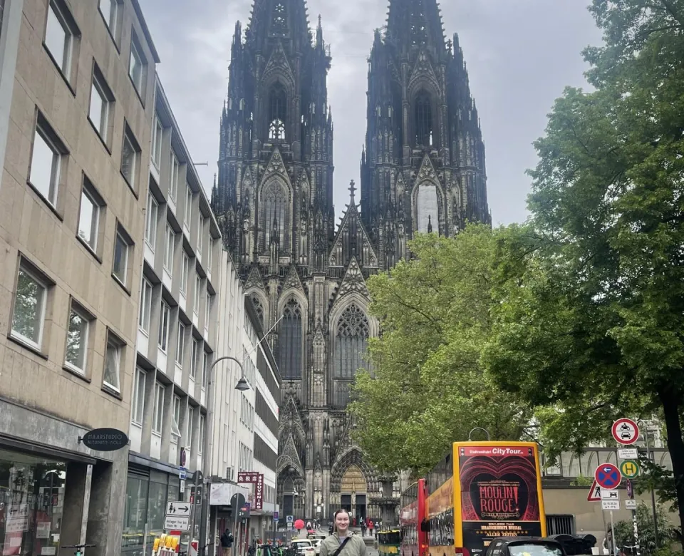 Student in front of large cathedral