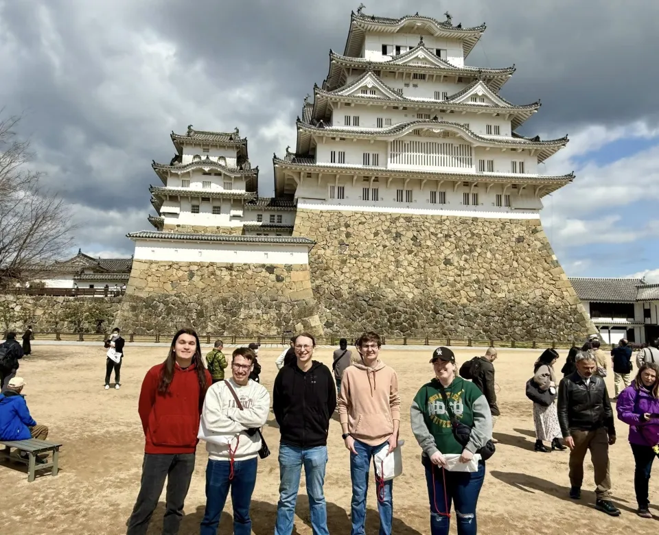 5 Students in front of a Japanese Temple