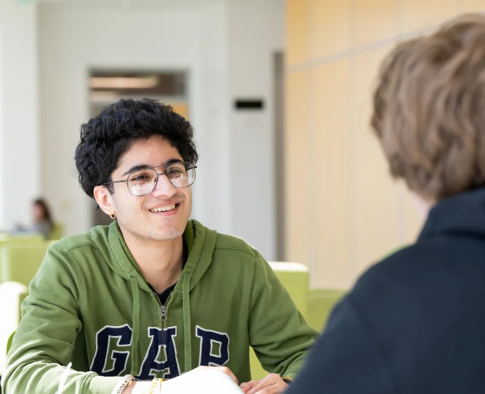 students study together in a campus building