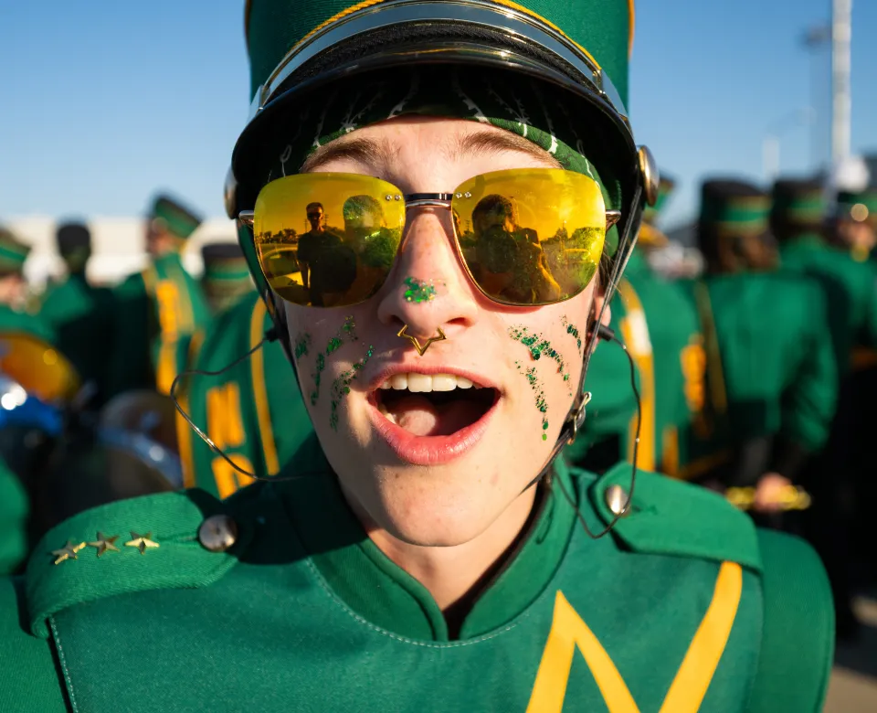close up of Gold Star Band member with yellow sunglasses on