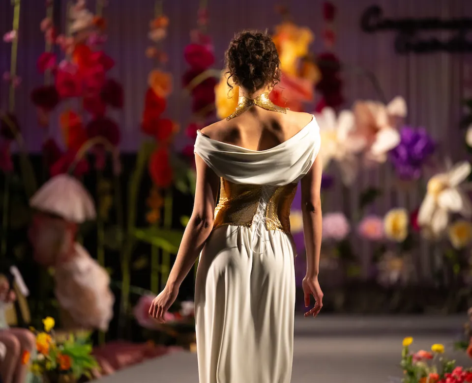 Model wearing floor-length dress.