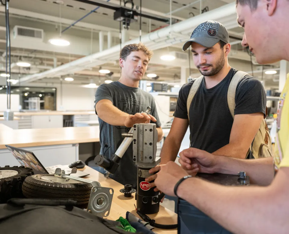 students working in bobcat shop