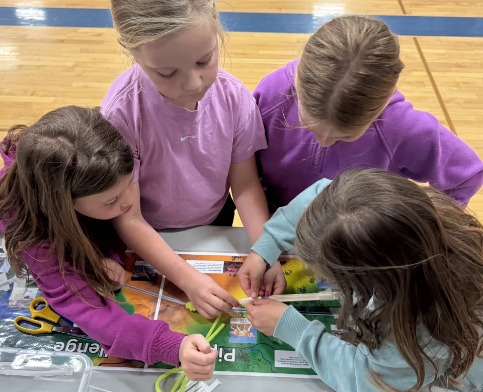 kids work on station at STEMzone