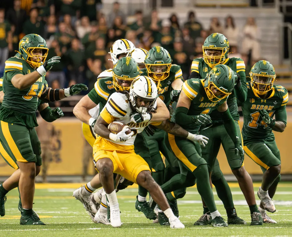 NDSU Bison football players tackle Wyoming running back
