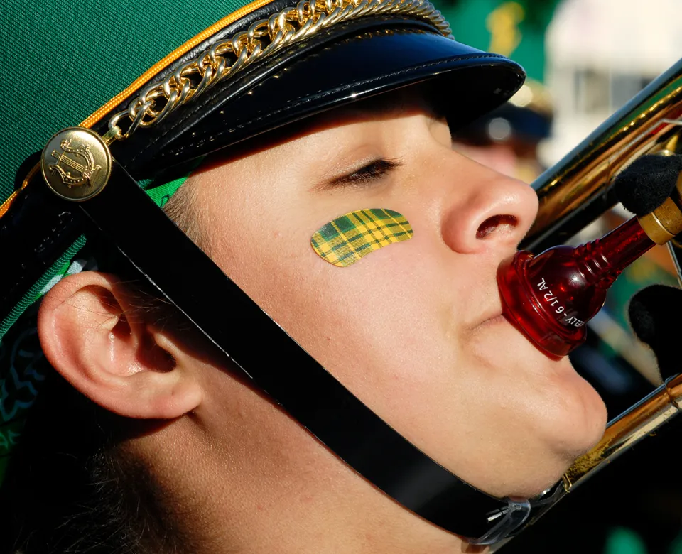 NDSU Tartan on marching band members face.