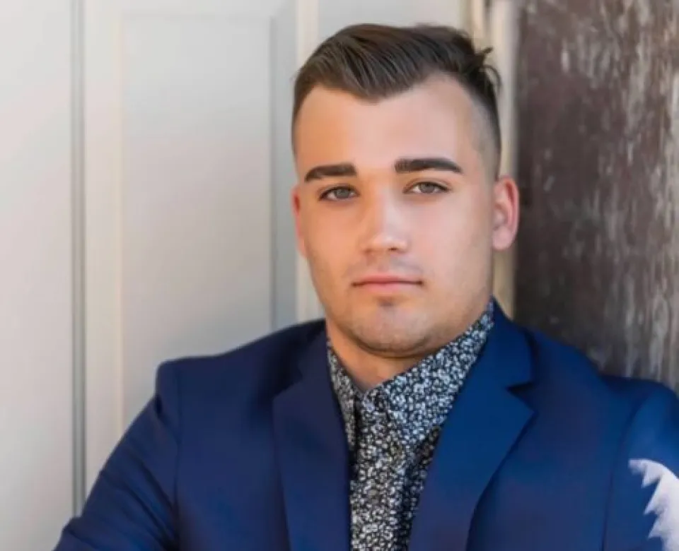 Maguire Martin looking confidently at camera.