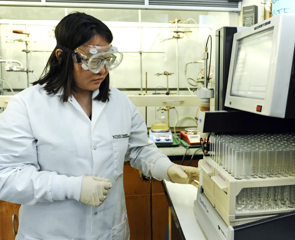 Student performing an experiment in lab