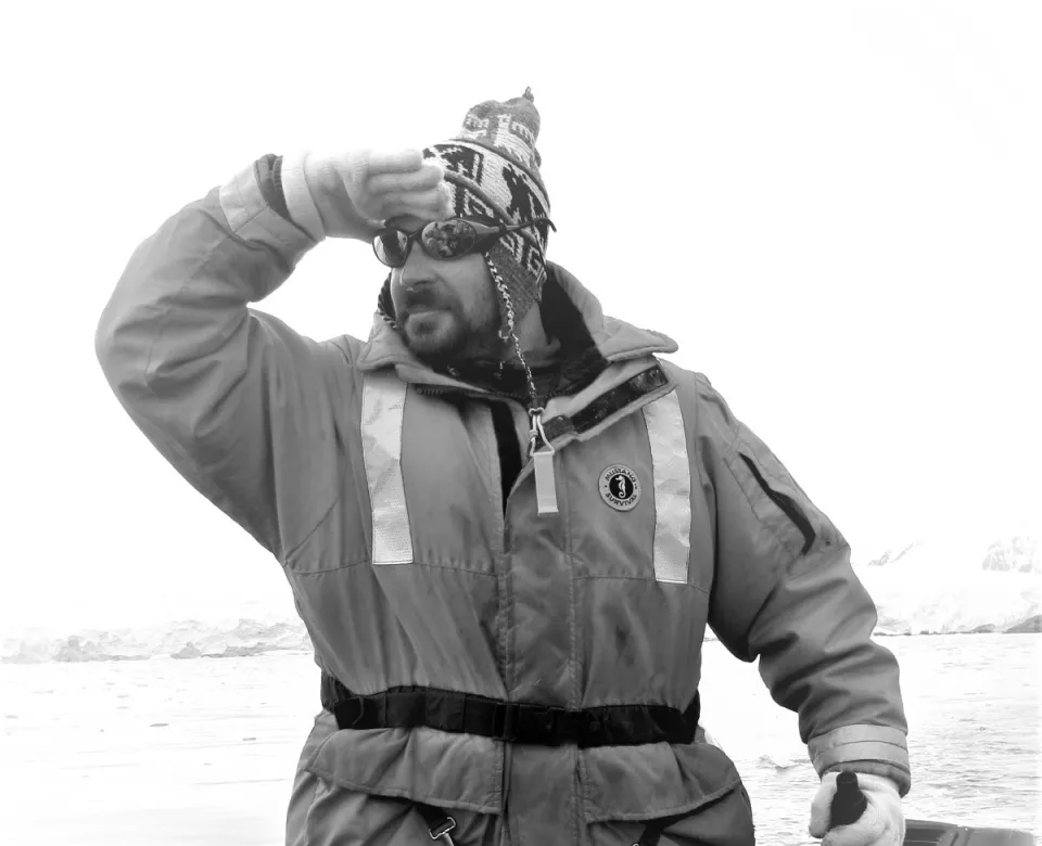 GC looking in the distance while riding in a boat.