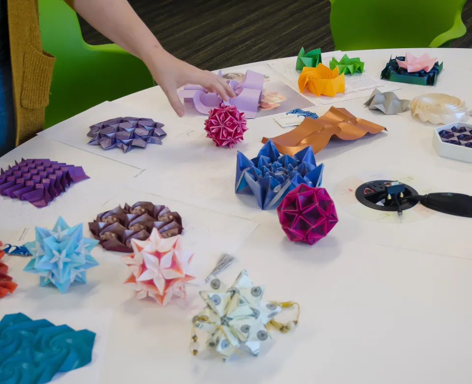 Sonia Kovalevsky Day supplies organized on a round table.