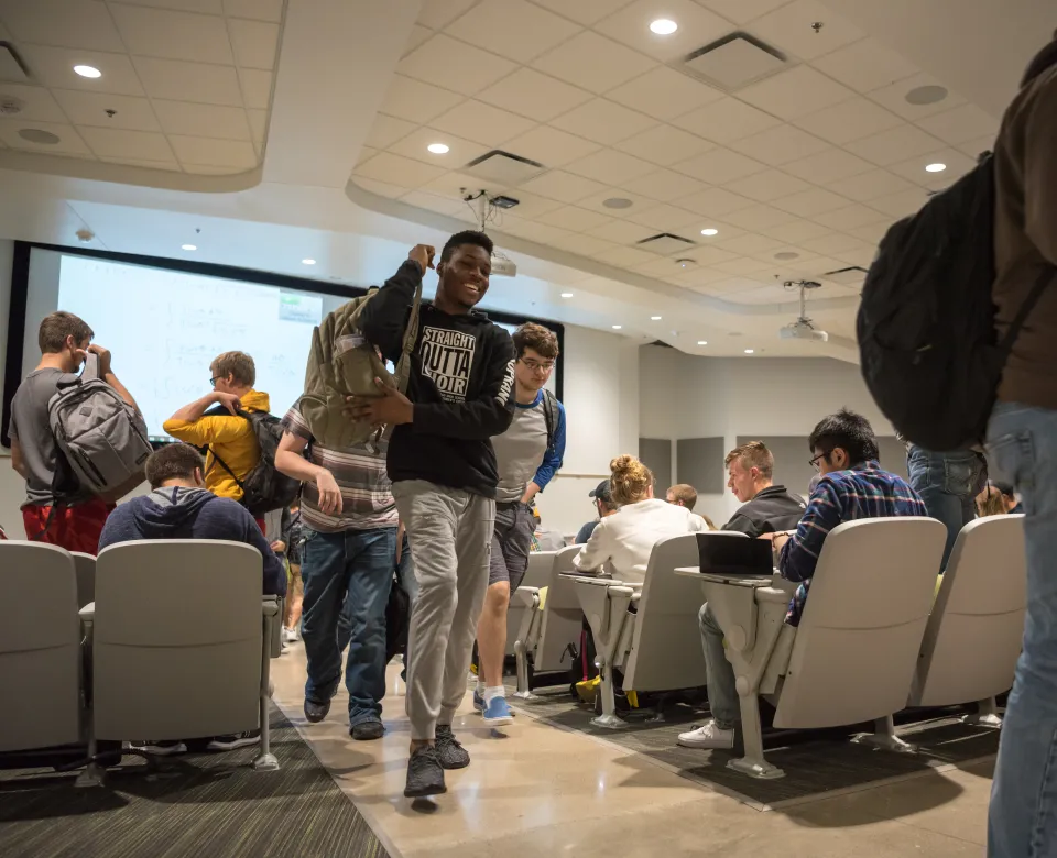 Students walking out of classroom.