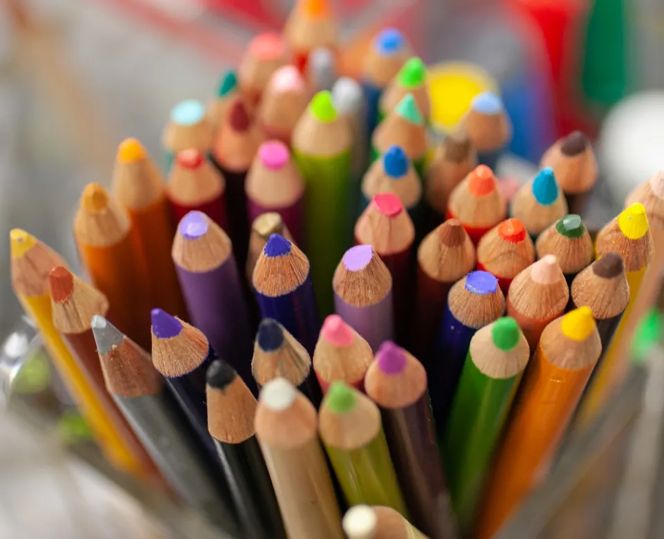 Jar full of many colored pencils