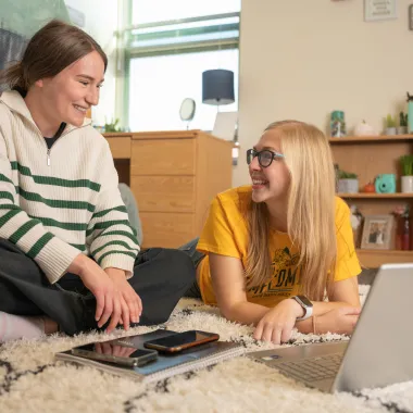 two roommates hanging out in their dorm room