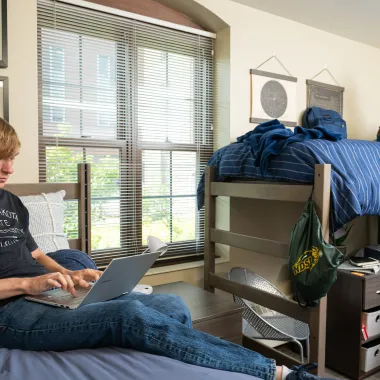 Two residents working in their room at Churchill.