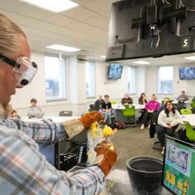 professor performing an experiment in class