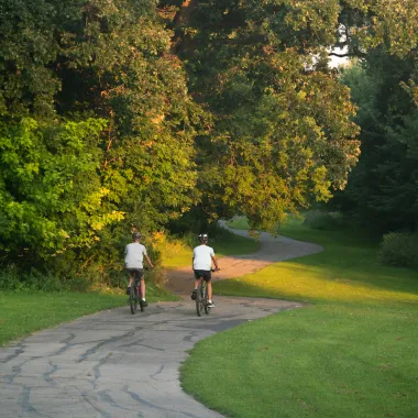 people riding bikes on one of Fargo's bike trails