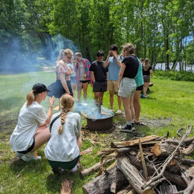 Scholars by fire at canoe trip