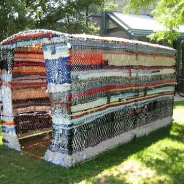 A fabric dwelling sits in a yard